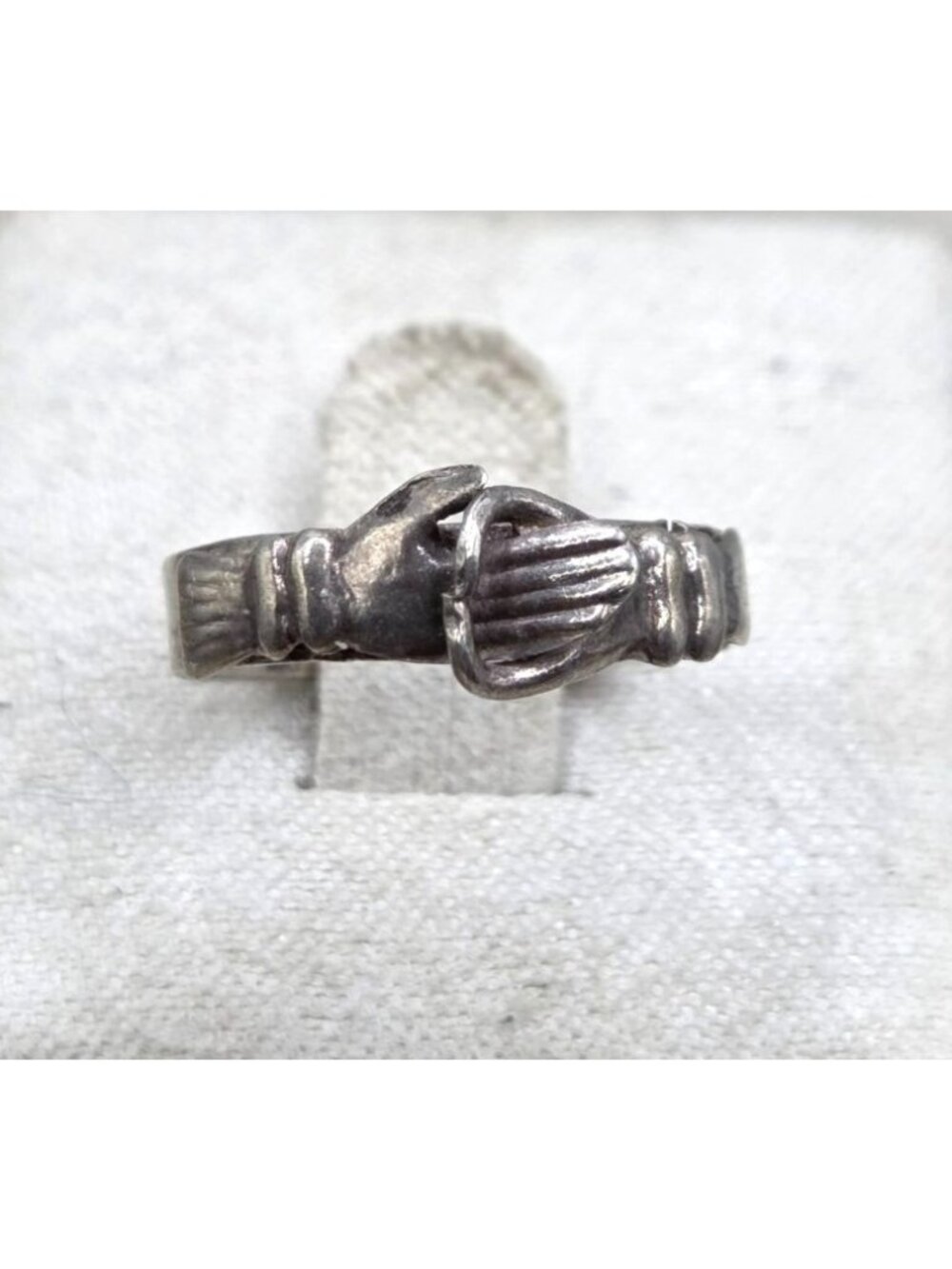 Silver Tone Size 5 Ring With Hand And Buckle Type Design